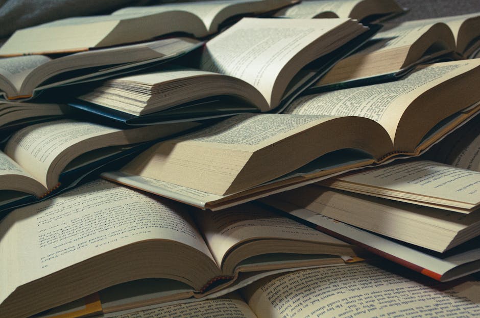 Line of old books including Little Women